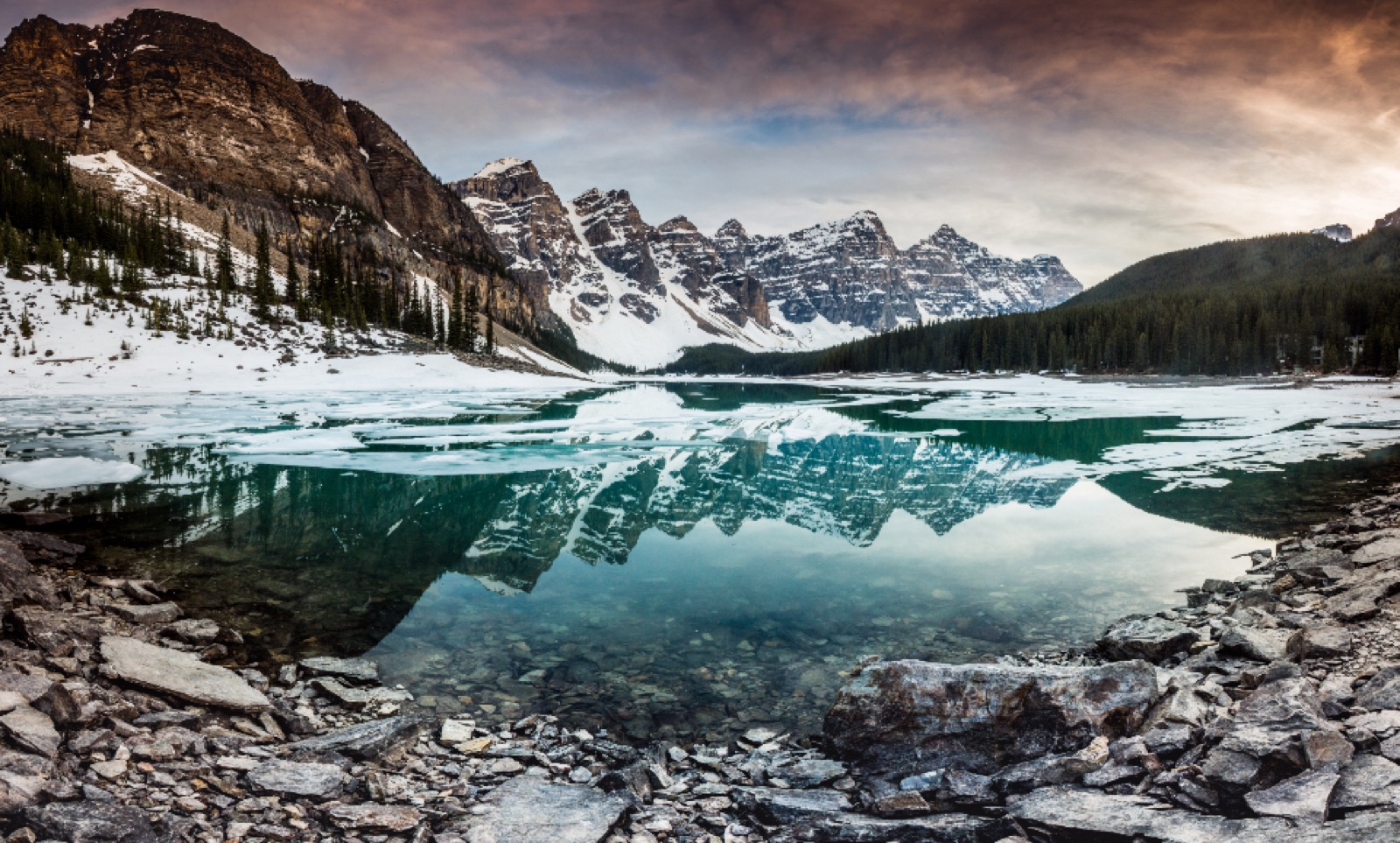 Photographer capturing a snowy winter landscape