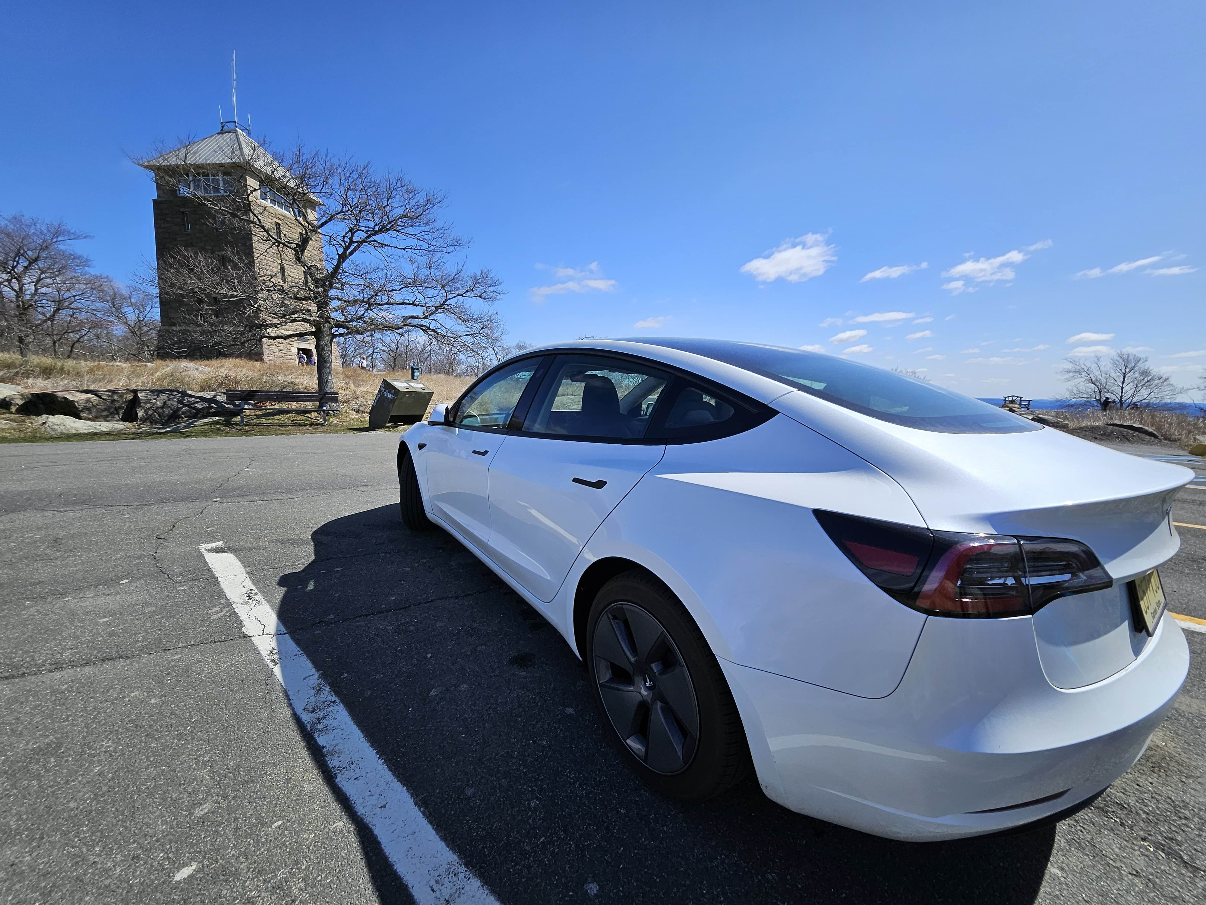 Perkins Memorial Tower with Tesla Model 3