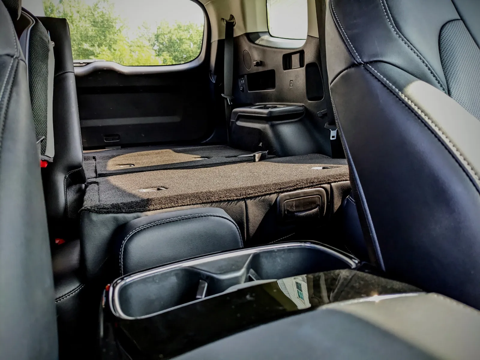 The Kia Telluride with the second and third rows folded flat, showing the maximum cargo area