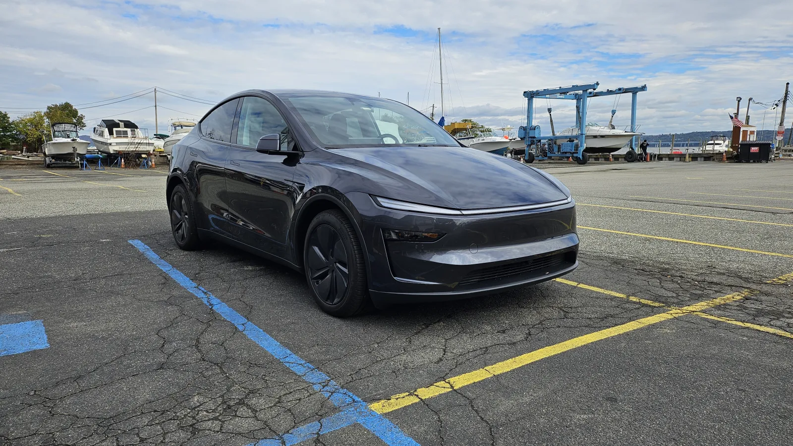 2026 Tesla Model Y parked at a marina